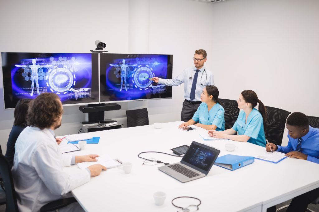 doctor giving presentation team interim doctors